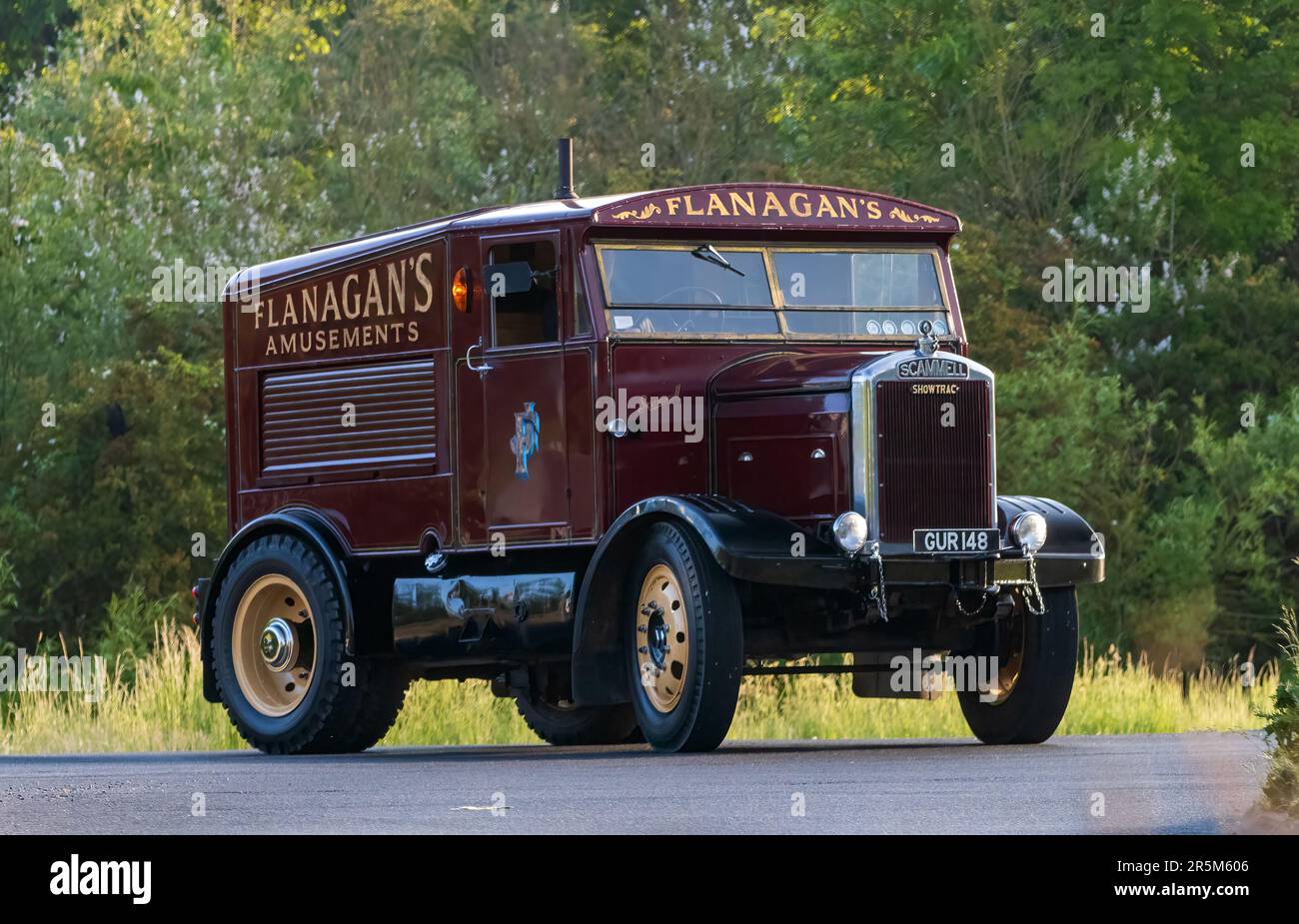 Stony Stratford,UK - June 4th 2023: 1946 Scammell Showtrac fairground vehicle driving in the rain. Number 10 of 18 built it sold for £167,500 in 2021. Stock Photo