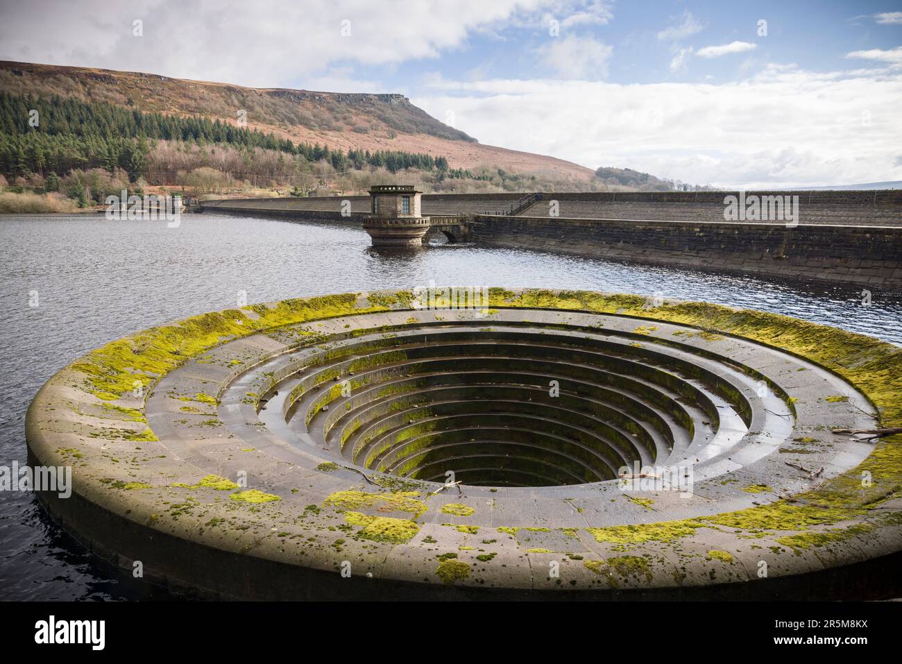 Ladybower reservoir dam wall and bellmouth spillway in winter, Peak District, UK Stock Photo