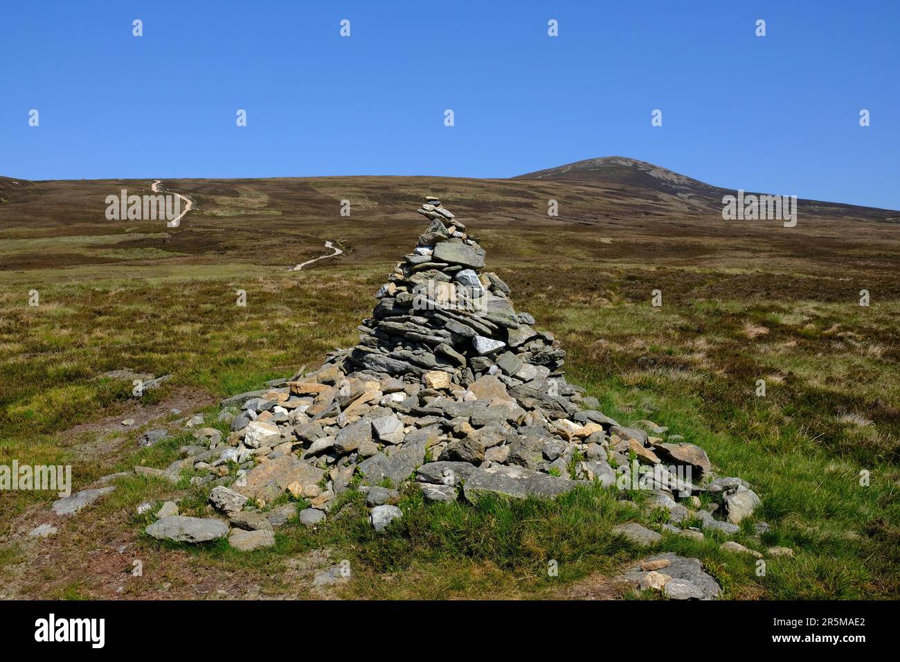 Navigation cairn on the track up to munro Mount Keen, Angus Glens, Scotland Stock Photo