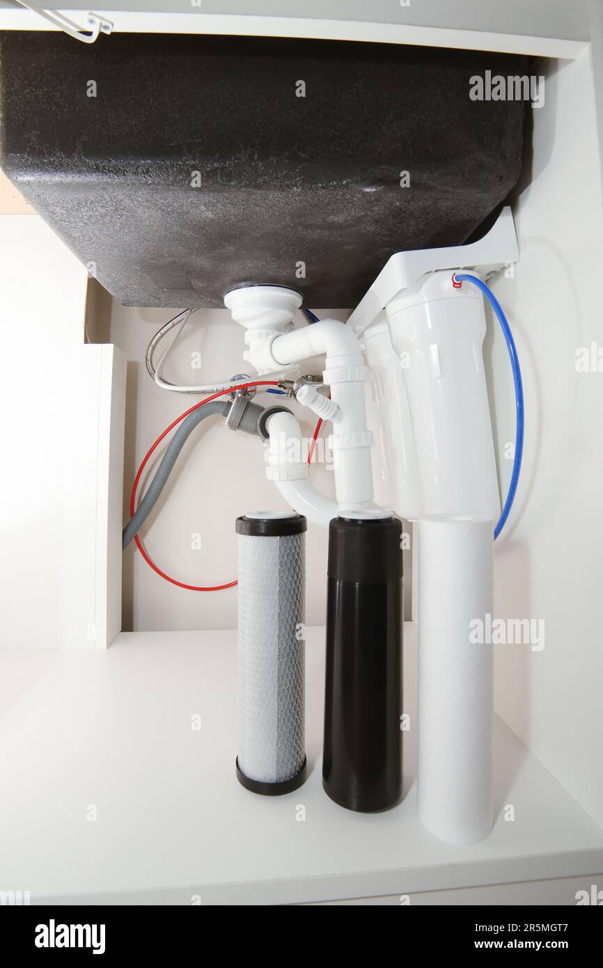 Reverse Osmosis Water Purification System Under Sink In A Kitchen Water  Cleaning System Installation Stock Photo - Download Image Now - iStock