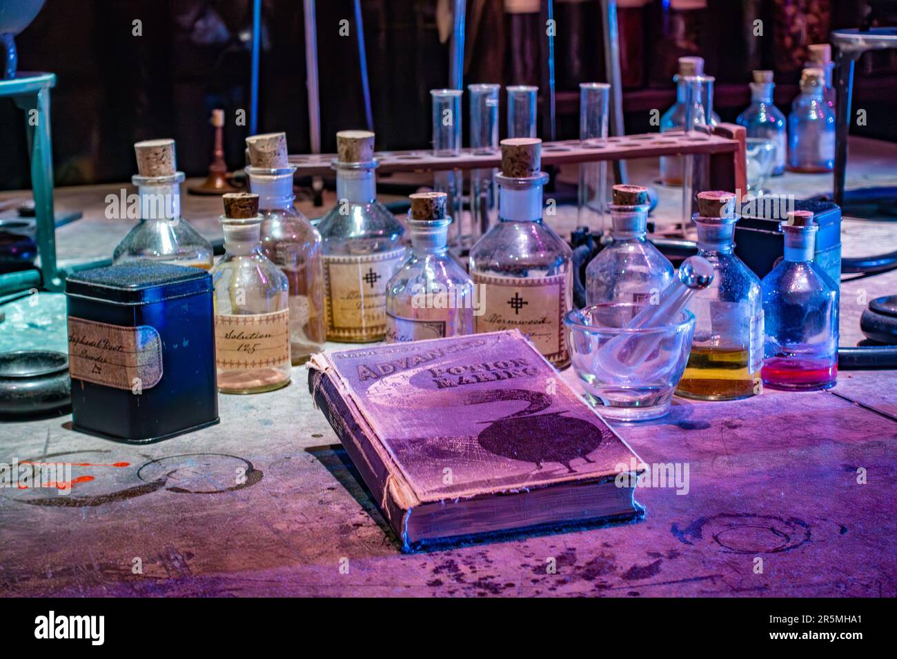 Close up of potion making equipment on a desk in the potions lab set at Hogwarts School as seen