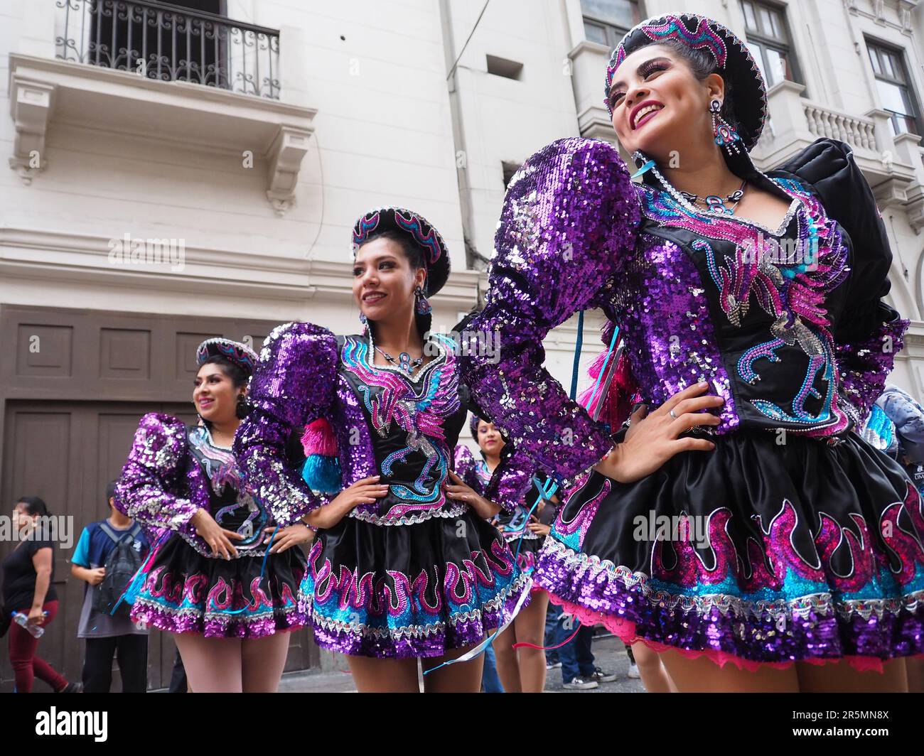 Troupe of women performing a dance, and wearing traditional costumes from Virgen of Candelaria Festival, took to the streets of Lima downtown to carry out a Folklore parade. It has become a tradition in Lima for Andean migrants to carry out folk parades every Sunday. Stock Photo