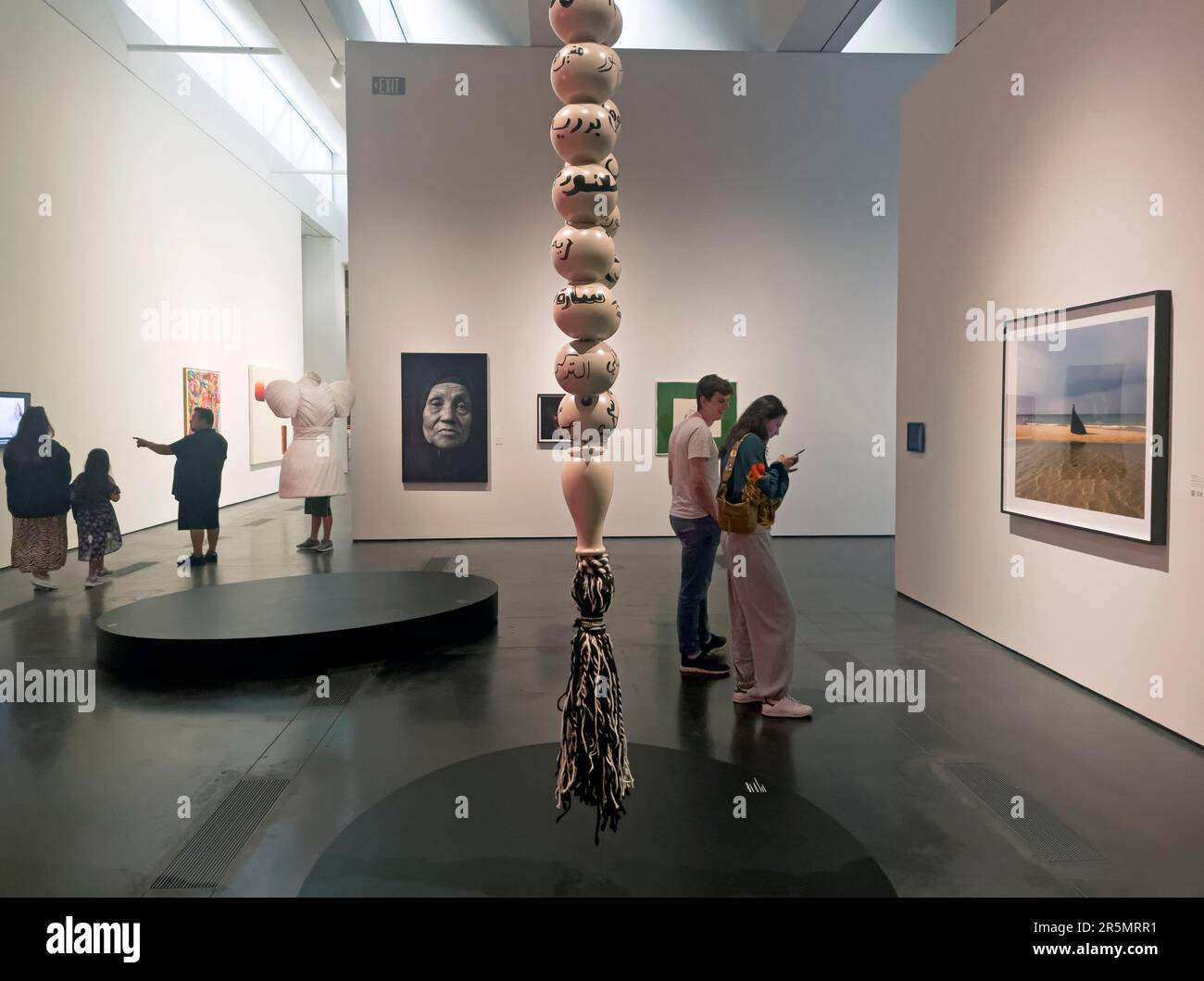 People visiting the exhibition "Women Defining Women" at the Los