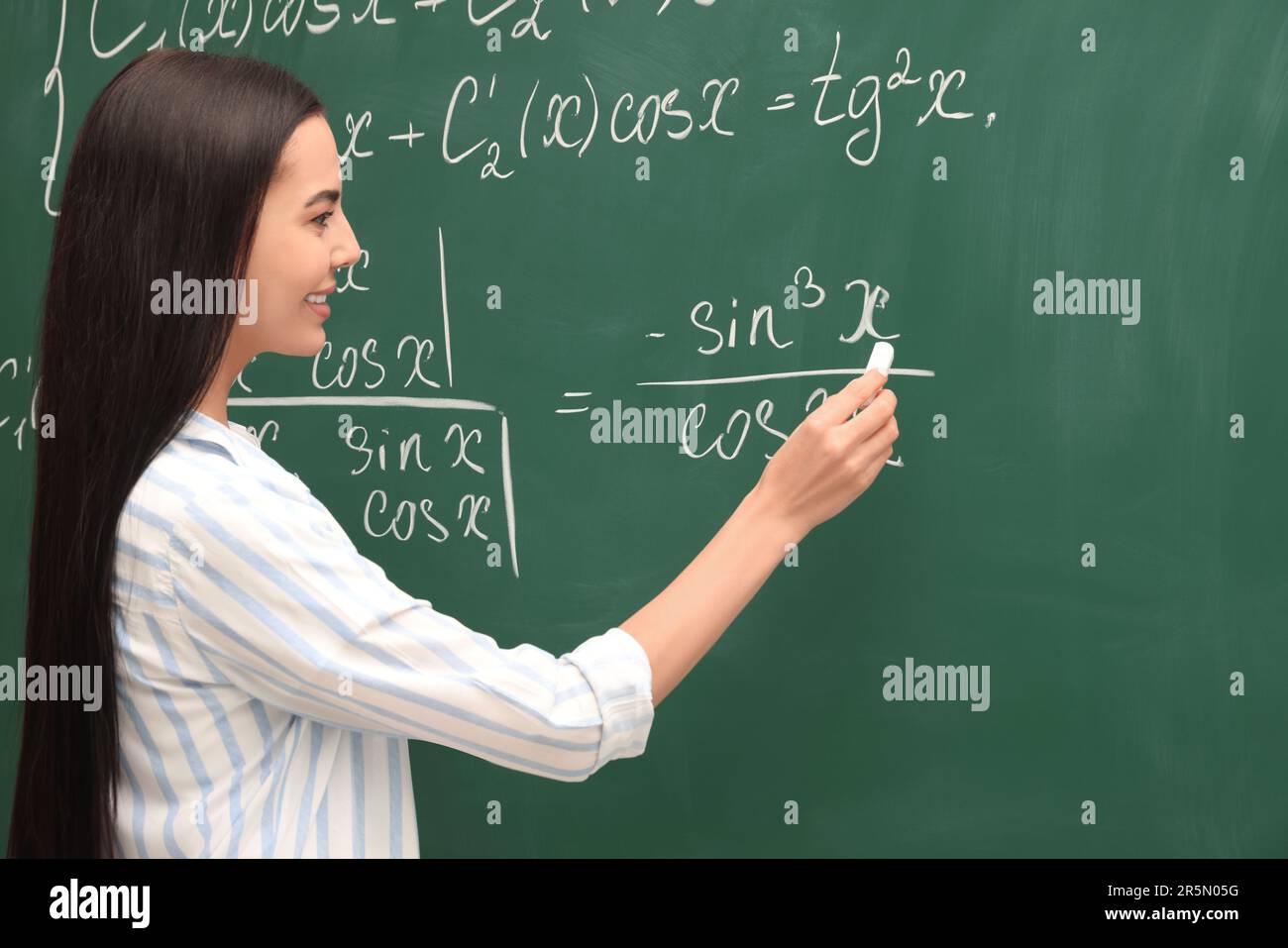 Explaining woman in green hi-res stock photography and images - Alamy