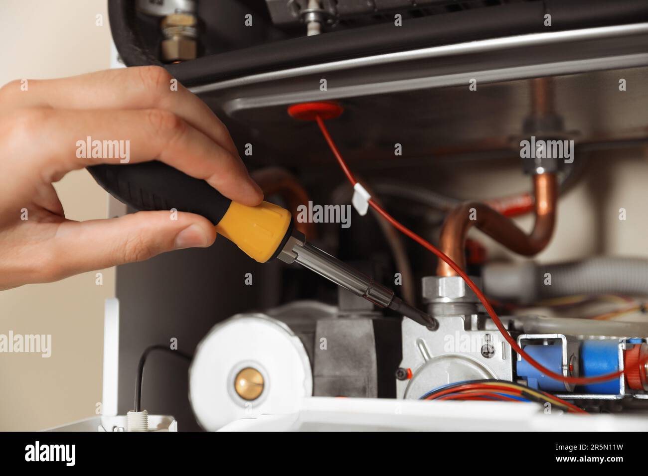 Repairing maintenance gas water heater hi-res stock photography and ...