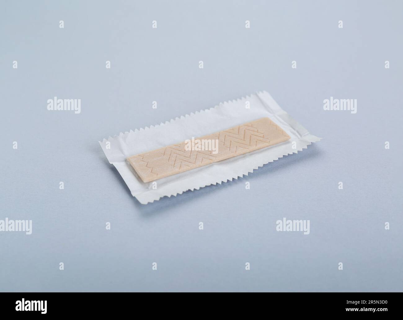 Unwrapped stick of chewing gum on light grey background Stock Photo