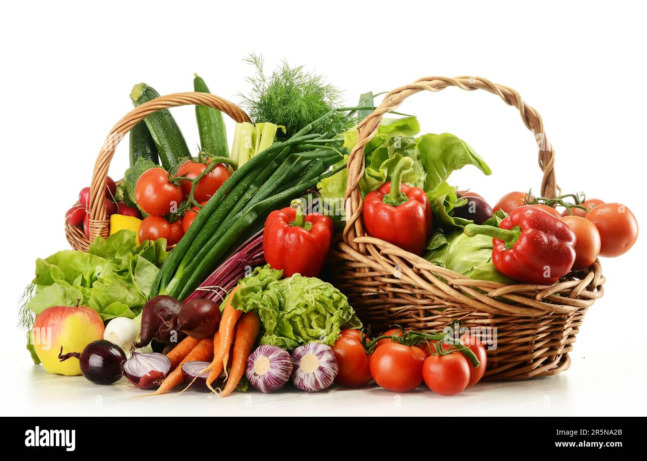 Composition with raw vegetables and wicker basket isolated on white Stock Photo