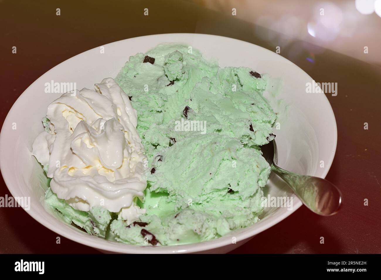 Chocolate chip mint ice cream in a white bowl Stock Photo - Alamy