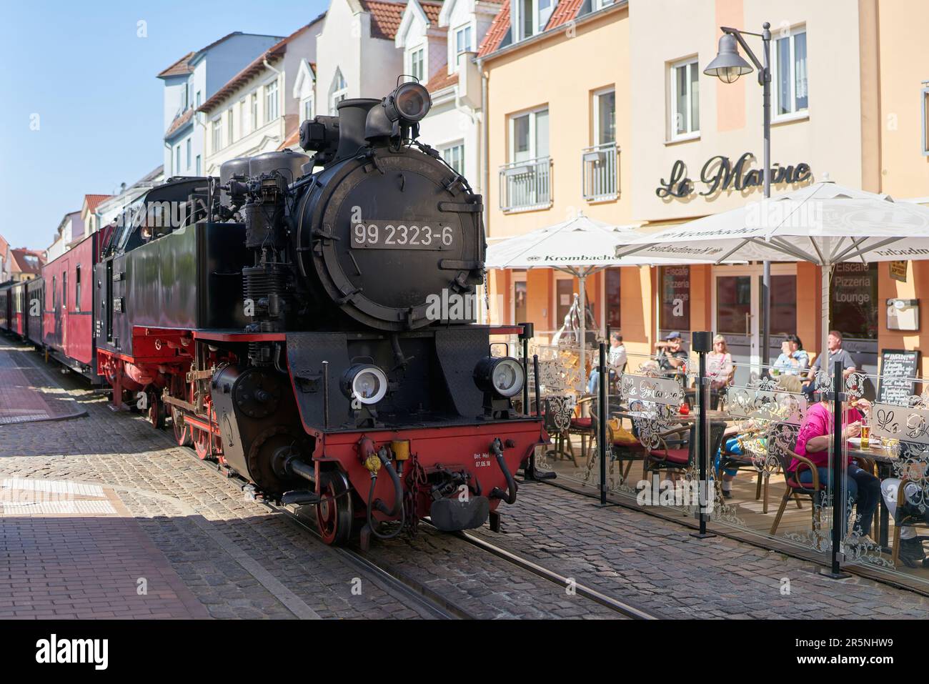Passenger train of the tourist train Molli during your journey through the old town of Bad Doberan at the German Baltic Sea Stock Photo