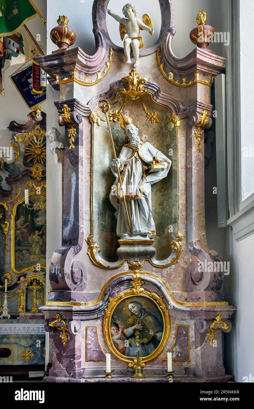 Side altar with the figure of St. Nicholas of Myra, Holy Trinity Parish Church in Sulzberg, Allgaeu, Bavaria, Germany Stock Photo