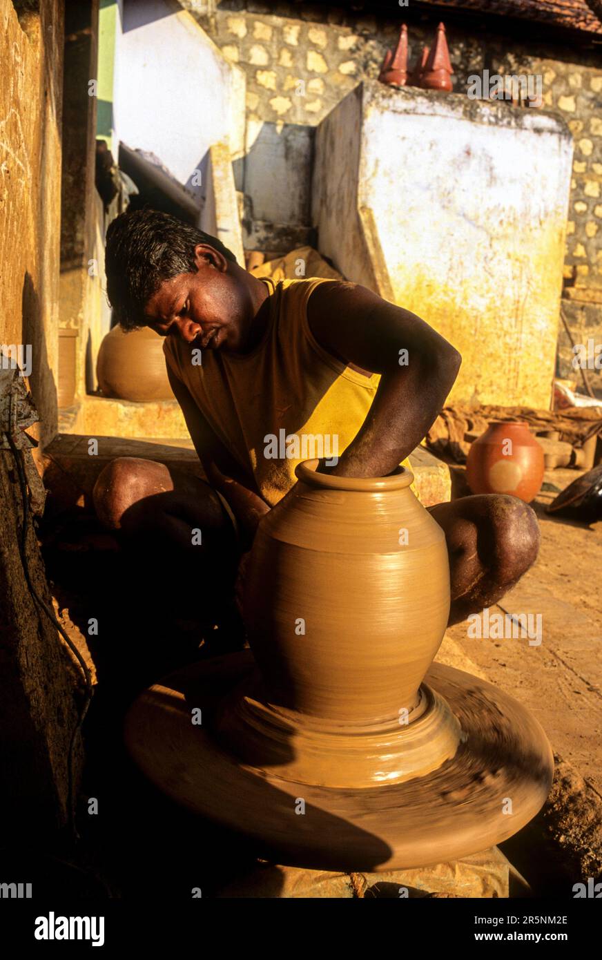 A man making Ghatam percussion instrument at Manamadurai, Tamil Nadu