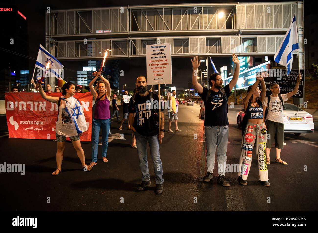 Tel Aviv, Israel. 03rd June, 2023. Protestors against the reform hold placards as they block the Ayalon highway during the demonstration. Israeli Anti judicial overhaul protestors block the Ayalon highway. Credit: SOPA Images Limited/Alamy Live News Stock Photo