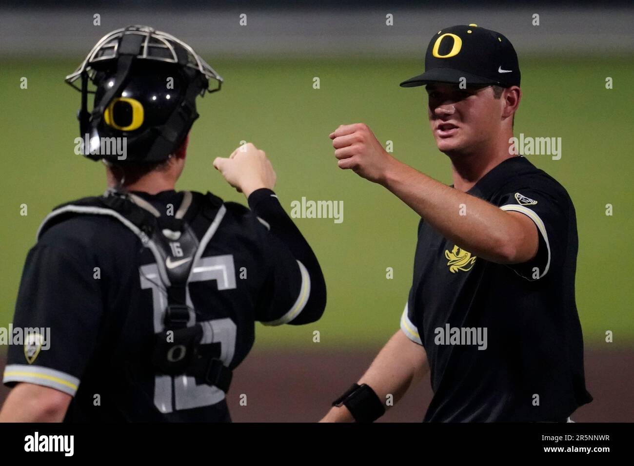 Oregon catcher Bennett Thompson (16) congratulates pitcher Grayson  Grinsell, right, after the first inning against Xavier during an NCAA  college baseball tournament regional championship game, Sunday, June 4,  2023, in Nashville, Tenn. (