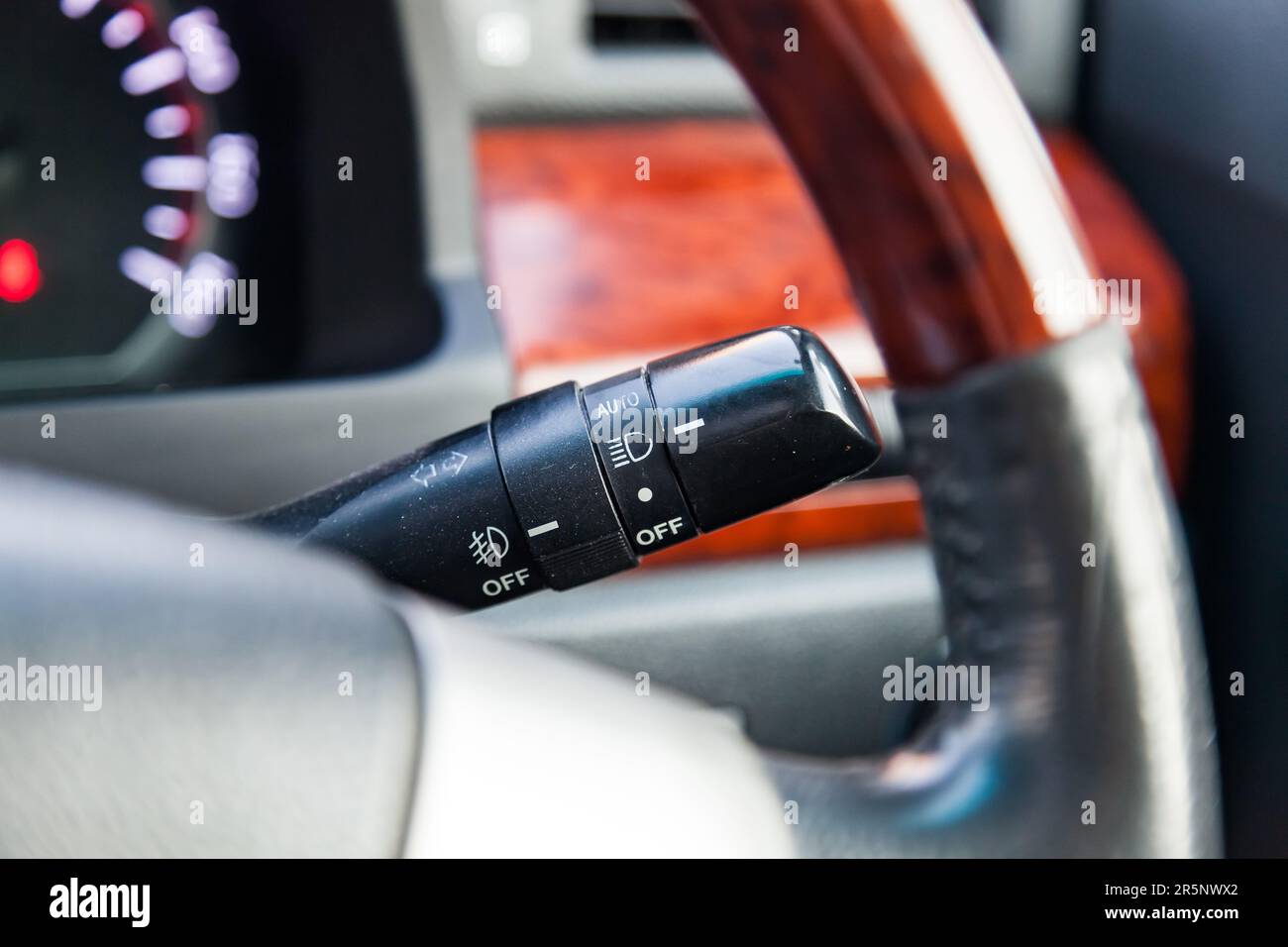 The lever for switching lights and turn signals under the steering