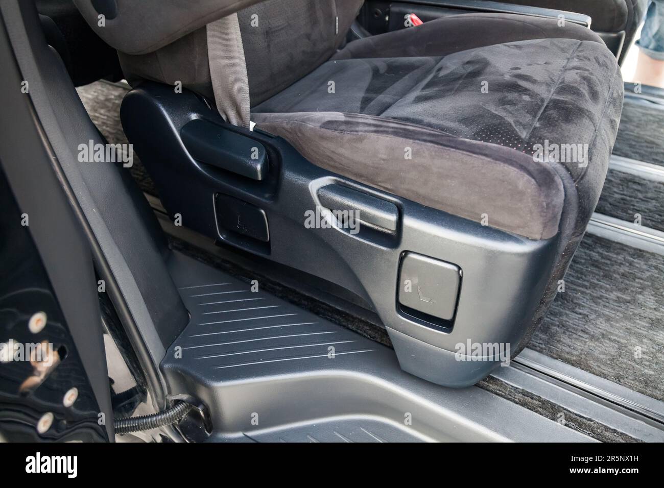 Closeup Interior view with manual seat adjustment of car with ottoman