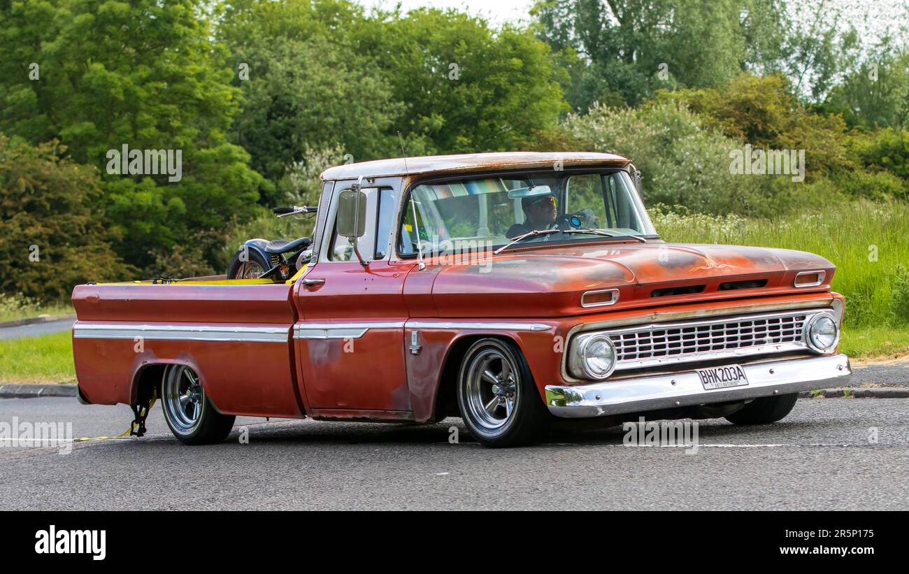 Stony Stratford,UK - June 4th 2023: 1963 CHEVROLET pick up truck     classic car travelling on an English country road. Stock Photo