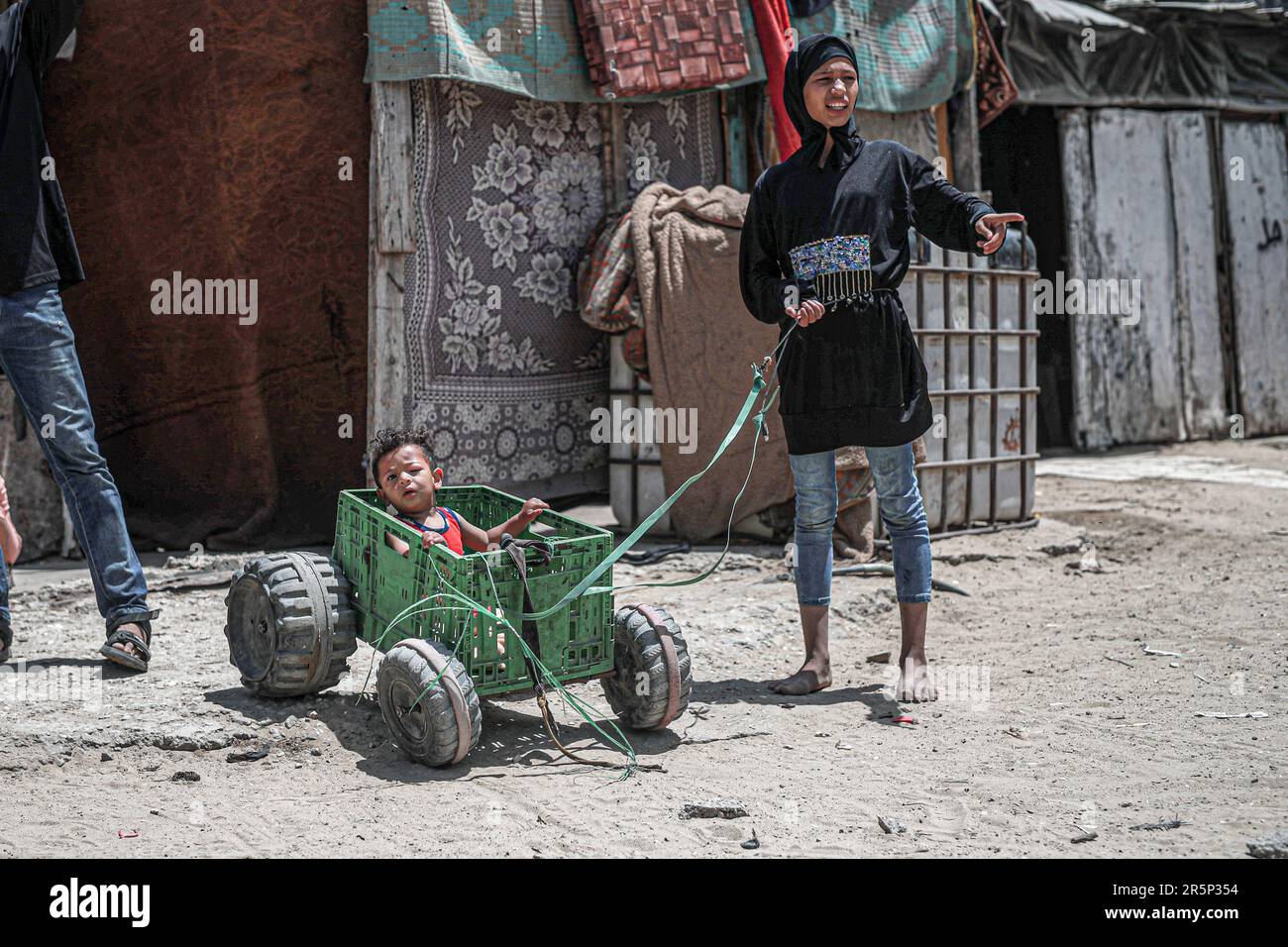 A family of ten who resides in the Al-Zaytoun area, is dependent on transportation using a donkey in the popular Firas market to earn between 10 to 20 shekels per day if there is work available. Without proper income, this family is struggling to survive even without basic meals. Palestinian people are suffering from siege, poverty, and the never ending war with Israel. Gaza City, Palestine. Stock Photo