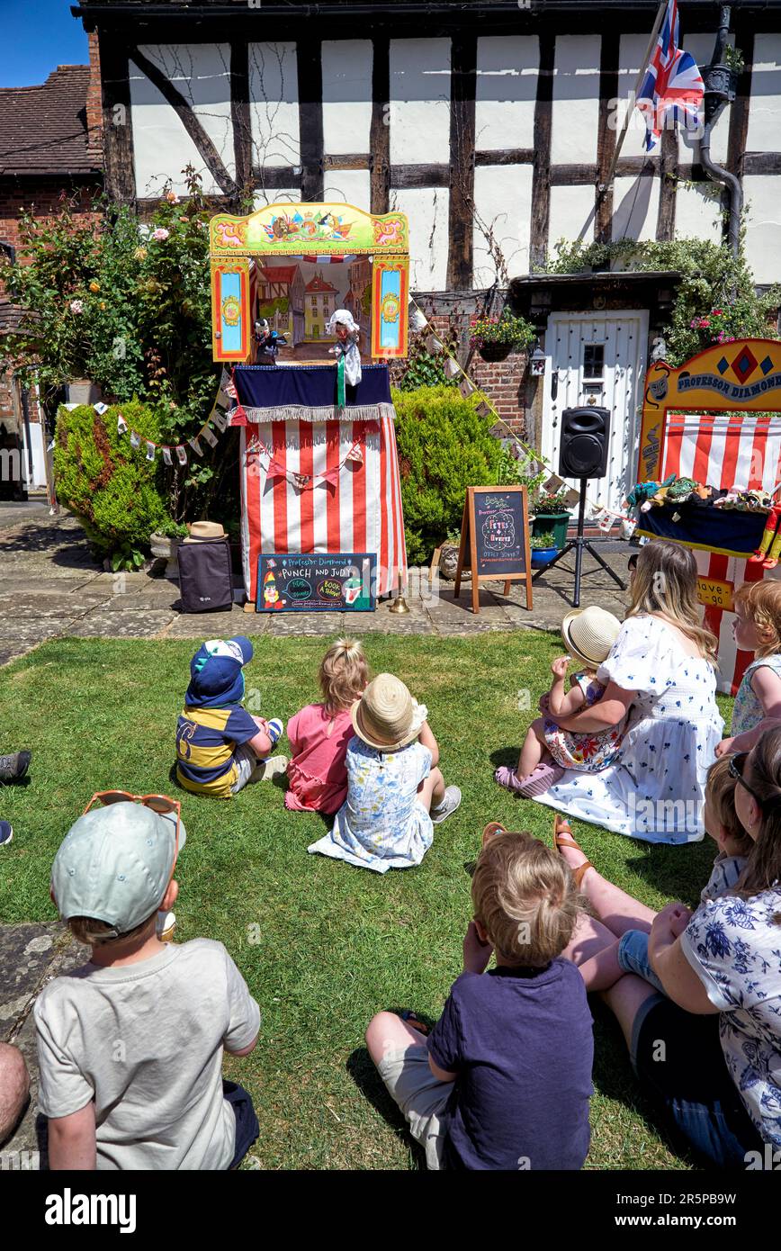 Punch and Judy show childrens traditional and historic entertainment on the village green