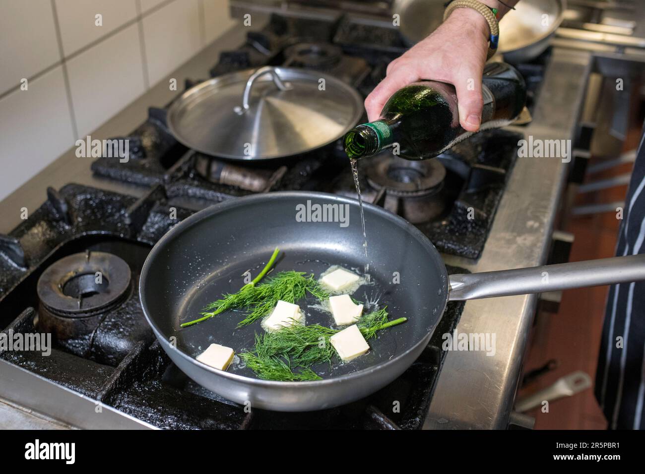 Chef putting food from hot hi-res stock photography and images - Alamy
