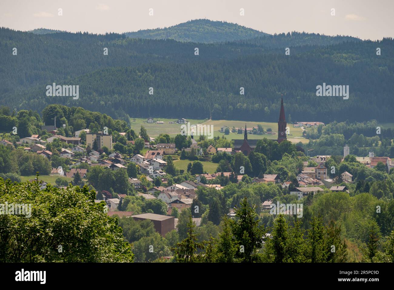 Scenic overview of the town Zwiesel in Bavaria, Germany on sunny day with clouds Stock Photo
