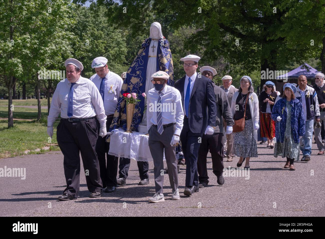 The procession at the beginning of a May Crowning service in Flushing Meadows Corona Park in Queens, New York. Stock Photo