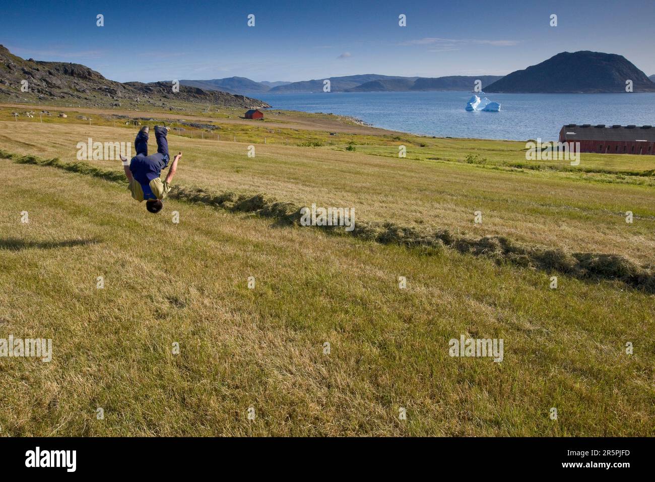 A farming student does a flip at the Agricultural Research Station in