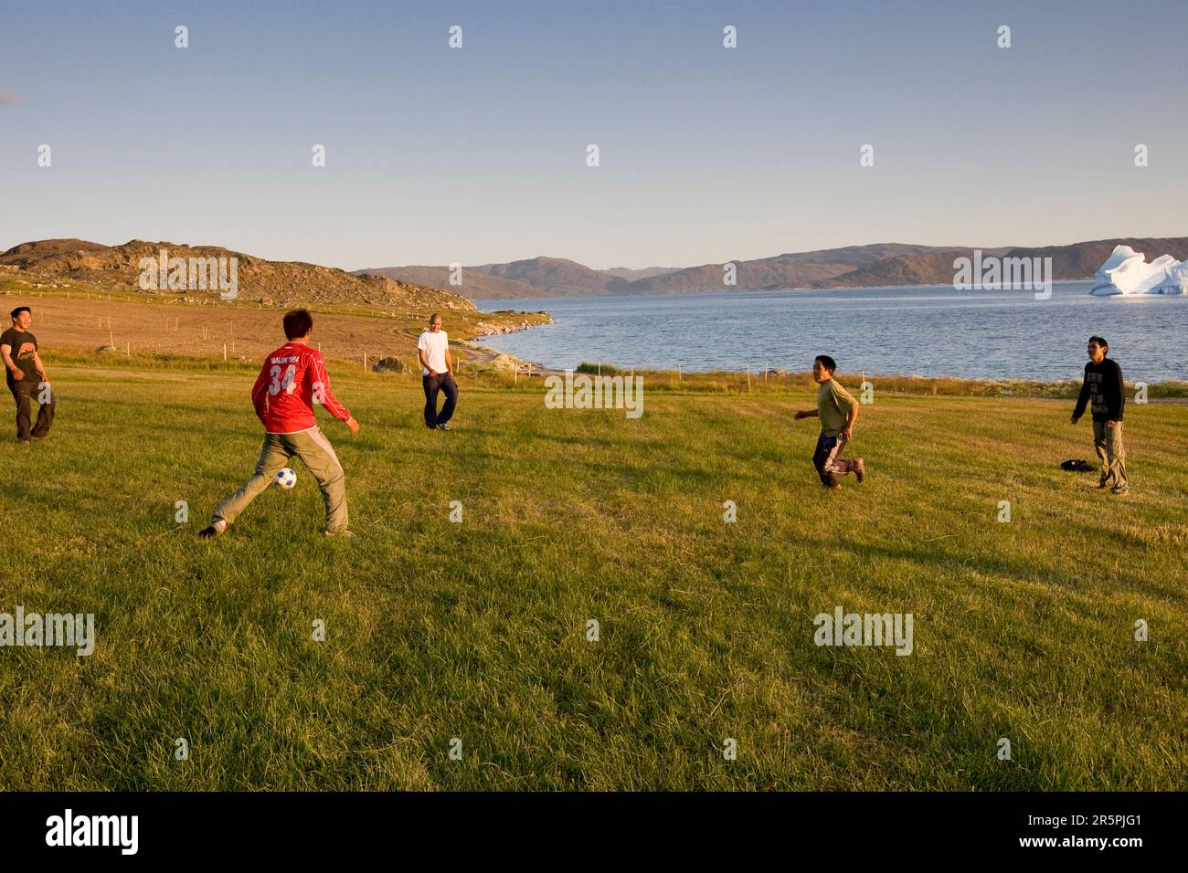 students playing soccer at the Agricultural Research Station in Upernaviarsuk,  Greenland. Stock Photo