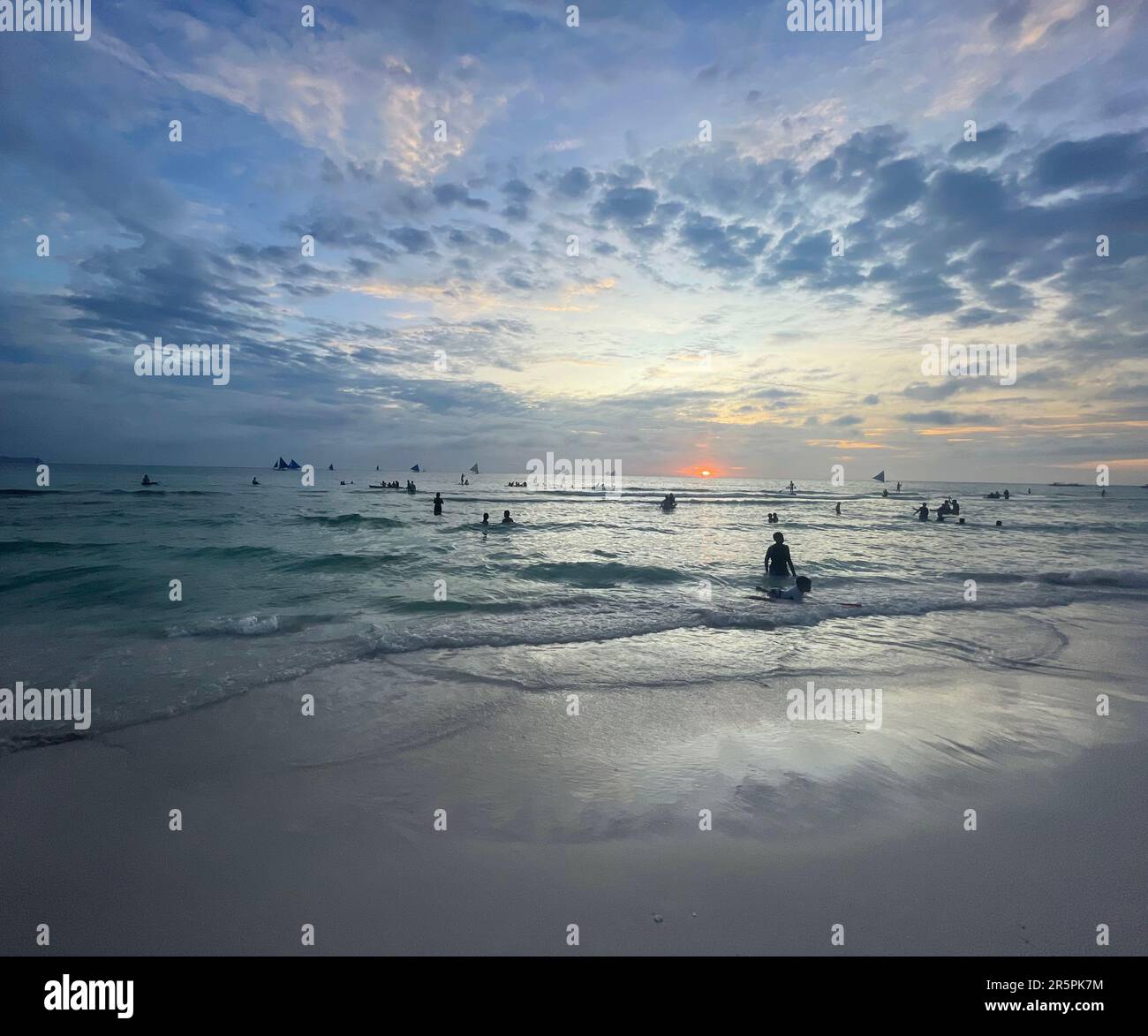 Blue Sunset Skies on Beach Waves Stock Photo - Alamy