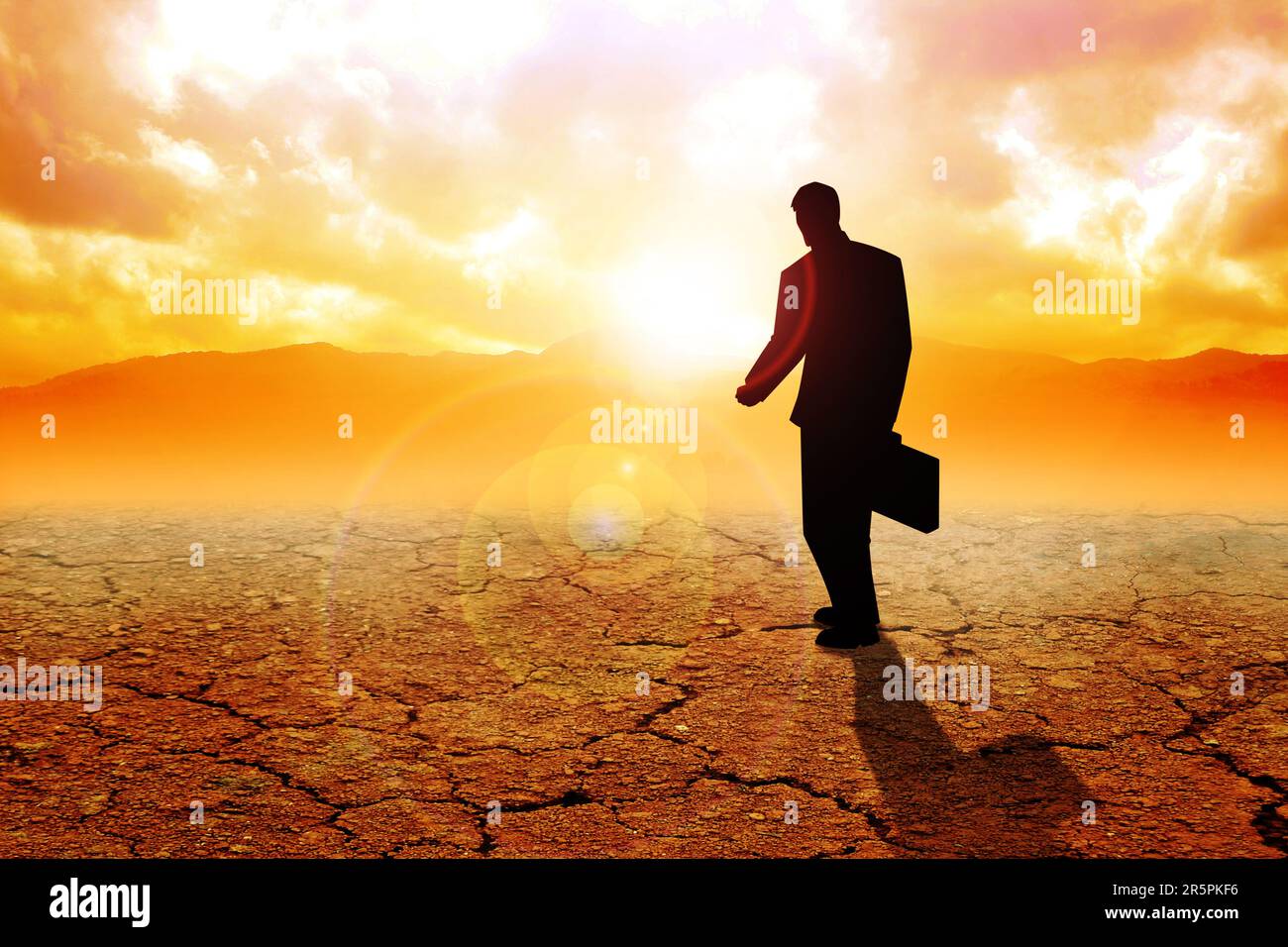 Silhouette illustration of a man with suitcase walking on dry land Stock Photo