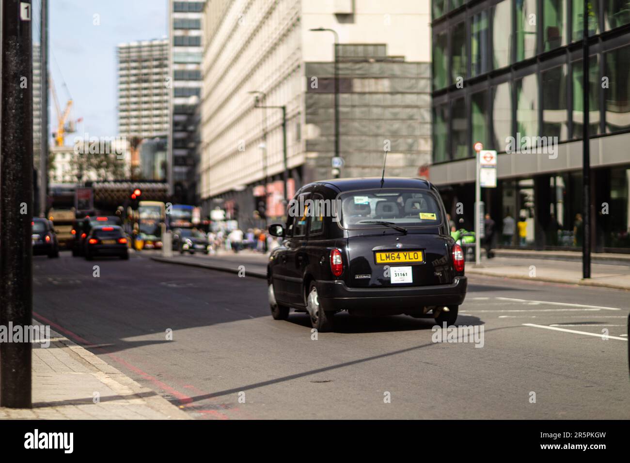 London, 29th May 2023: A classic cab is driving beside Forum Magnum Square. Stock Photo