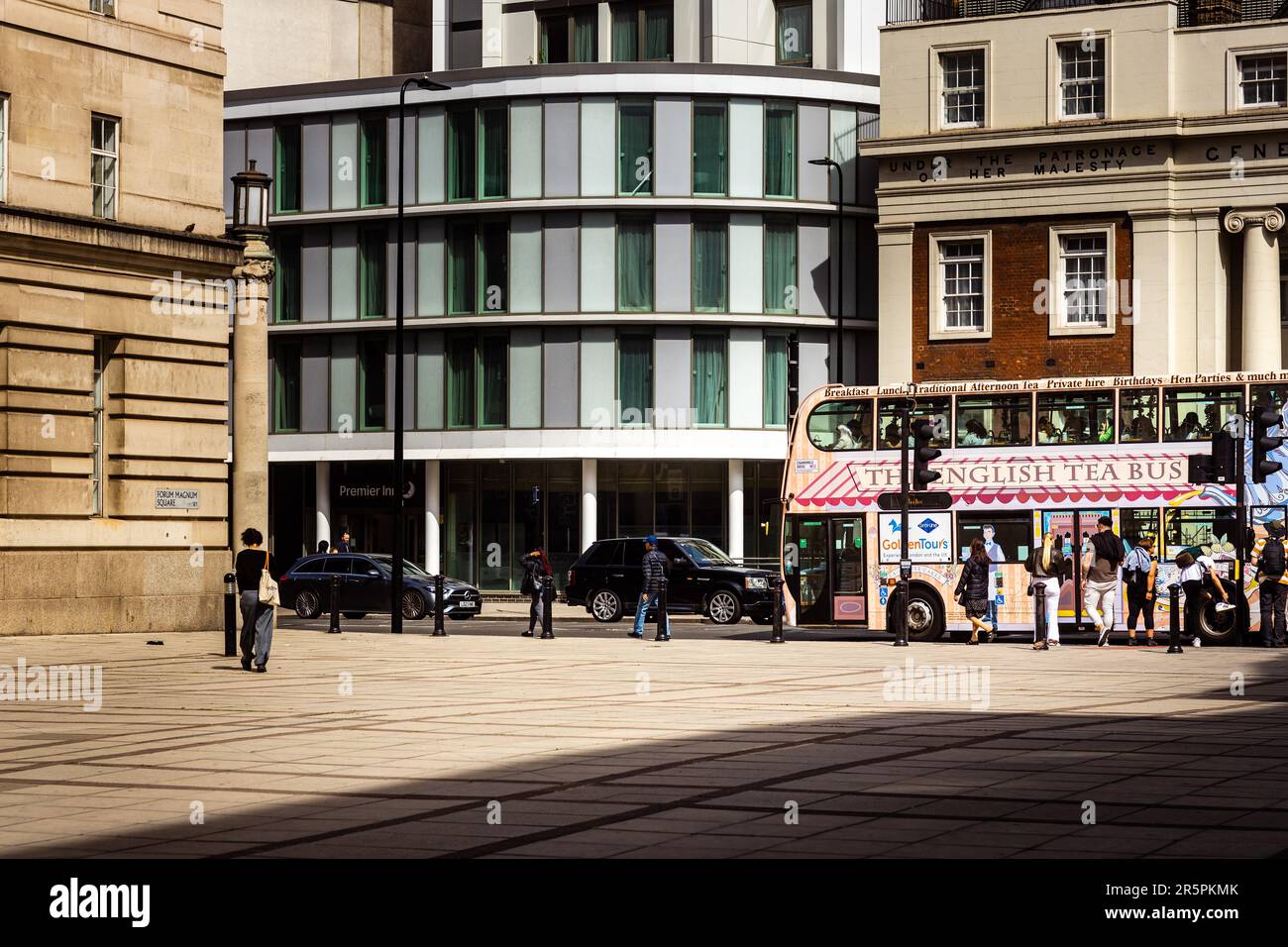 London, 29th May 2023: The English Tea Bus is driving beside Forum Magnum Square. Stock Photo
