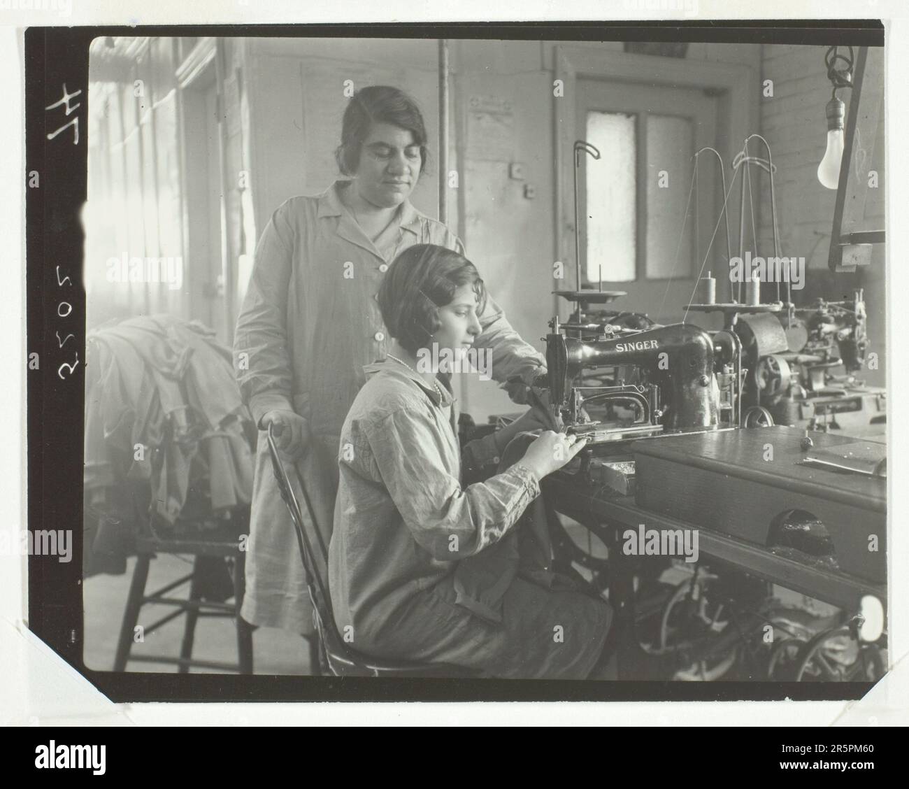 Factory Workers Women at work: c. 1910 Artist: Lewis Wickes Hine American, 1874–1940 Stock Photo