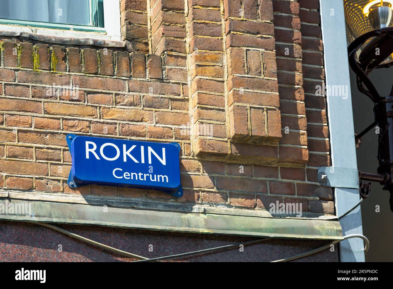 Rokin Street Sign in Amsterdam, The Netherlands. Rokin is a canal and major street in the centre of Amsterdam. Rokin also has its own Metro Station. Stock Photo