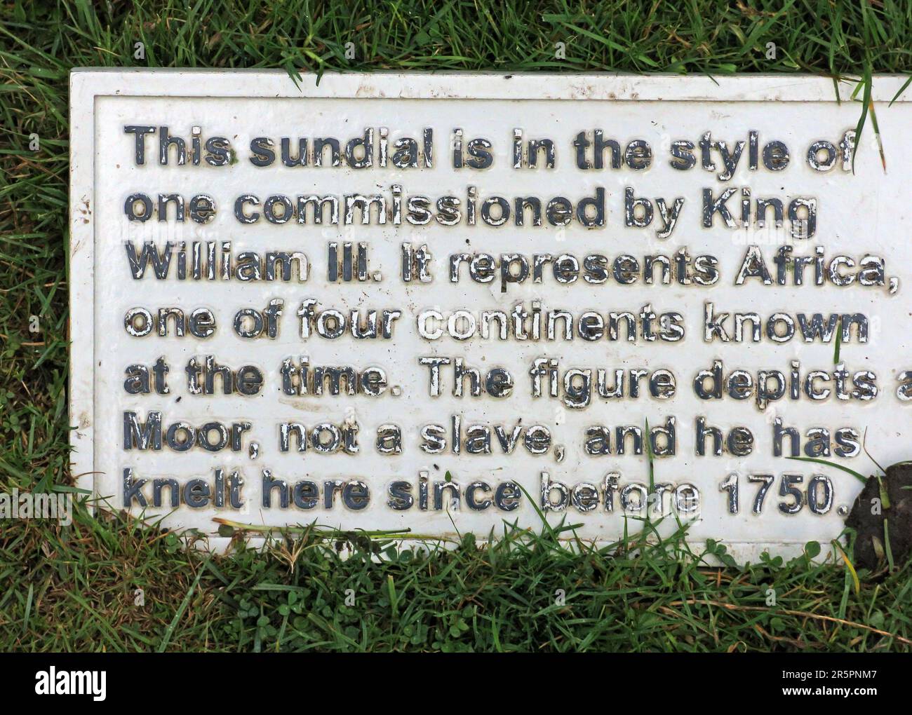 Historic sundial sculpture depicting a Moor figure at Dunham Massey, a National Trust estate near Altrincham, Greater Manchester Stock Photo