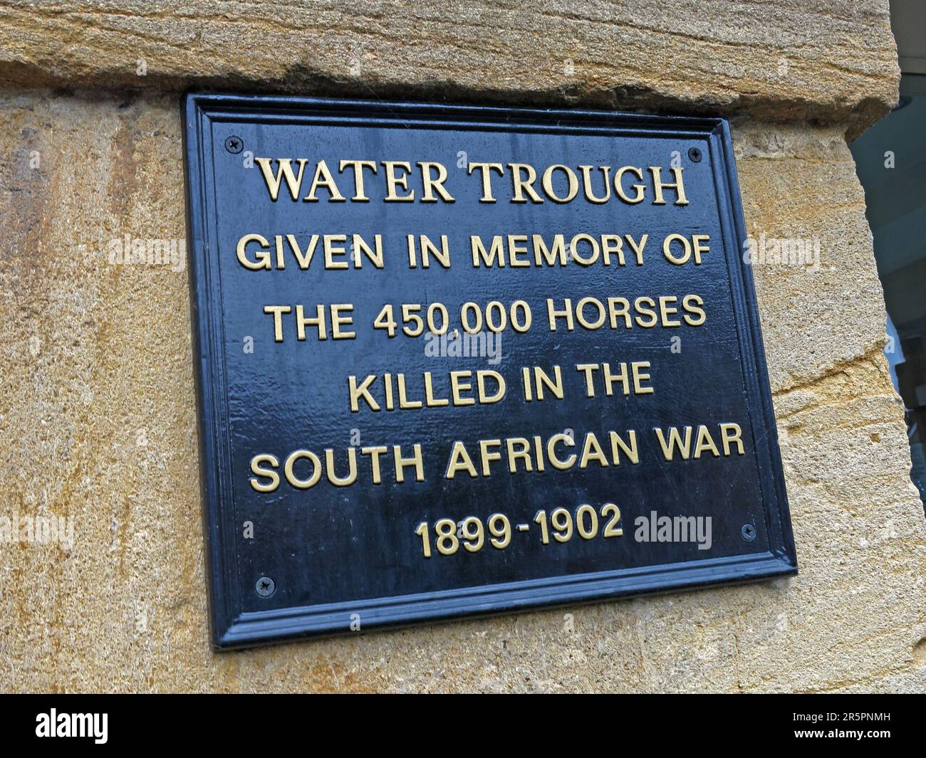 Plaque on a historic water trough memorial in Martock, Somerset, commemorating 450k horses killed during the South African War of 1899 to 1902. Stock Photo