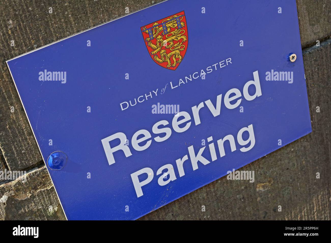 Reserved parking sign bearing the Duchy of Lancaster crest, indicating authorised parking only Stock Photo