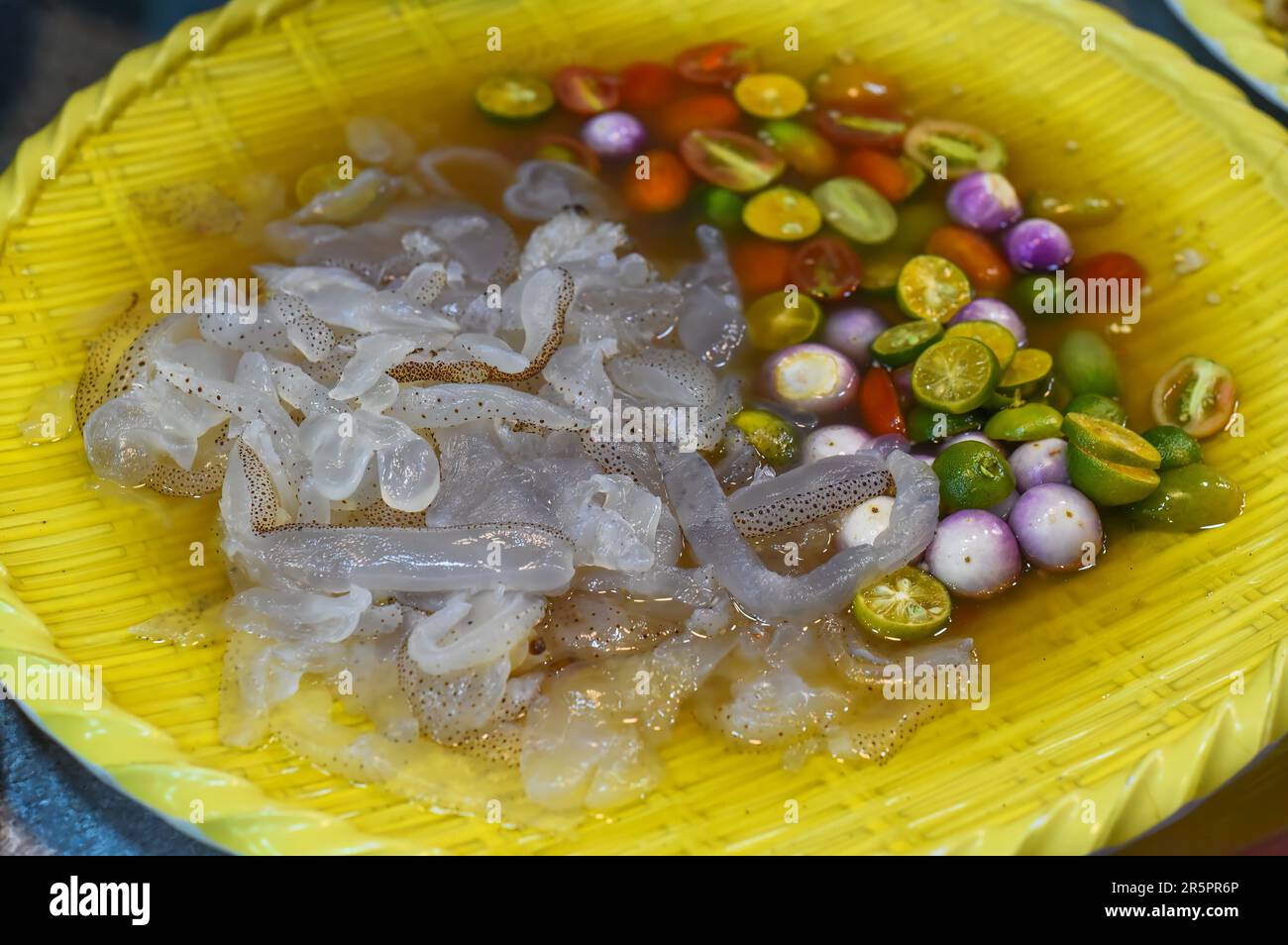 Vietnamese dish Jellyfish tentacles in sauce with vegetables Stock Photo