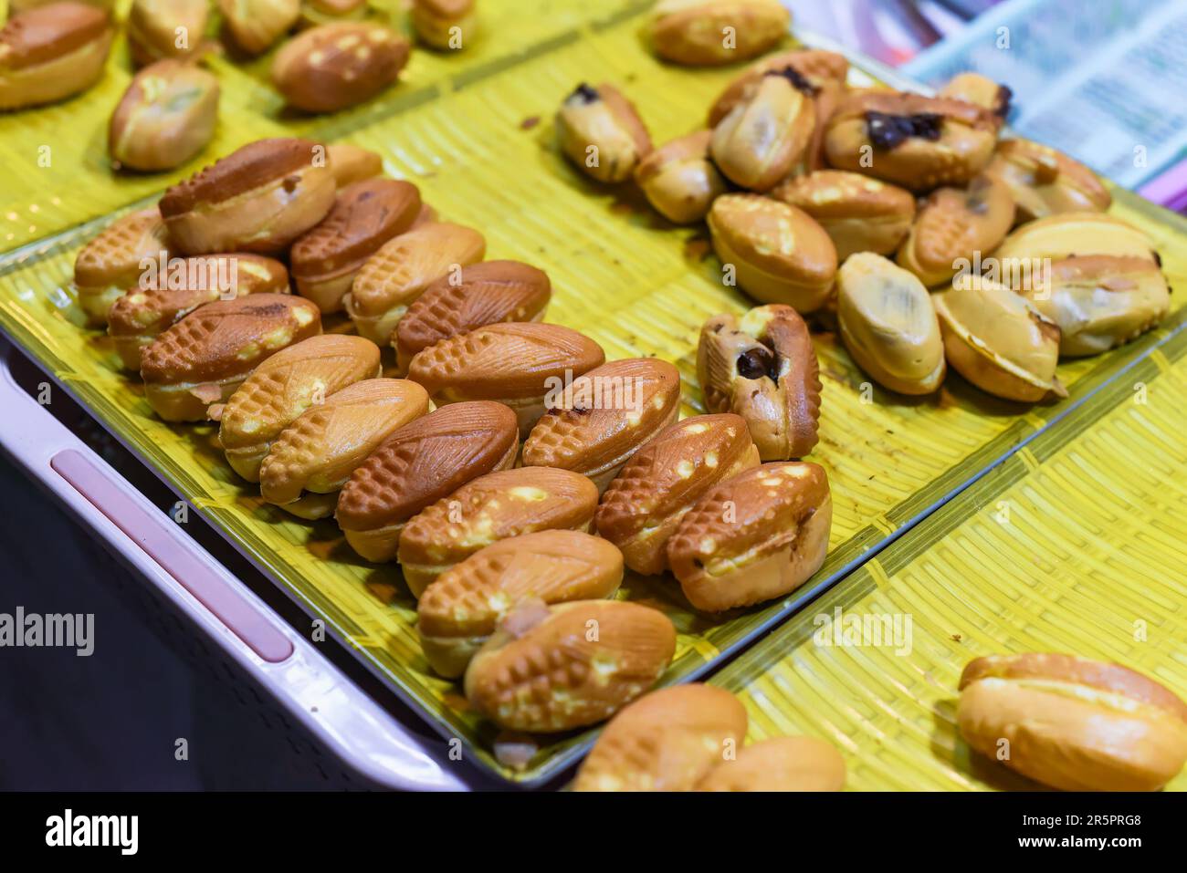 Vietnamese traditional corn cakes with chocolate sauce on a night