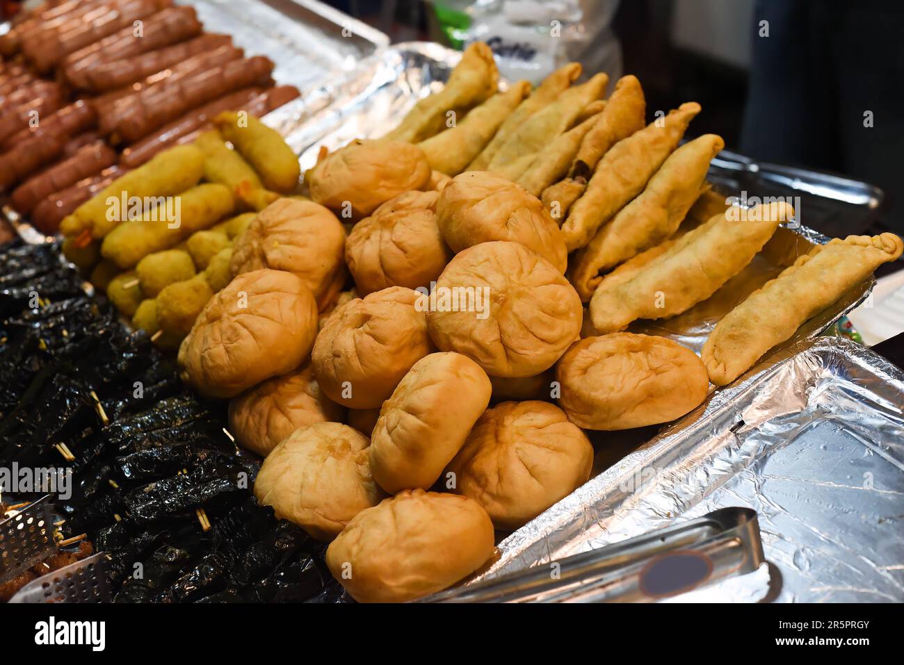 Vietnamese pies with meat and onion on a night market in food festival Stock Photo