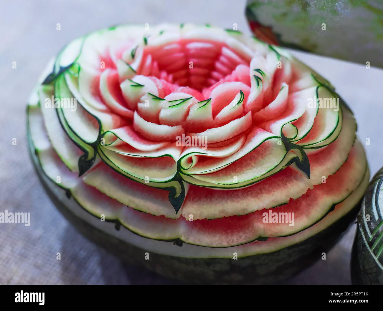 example of watermelon carving with patterns as flower petals Stock Photo