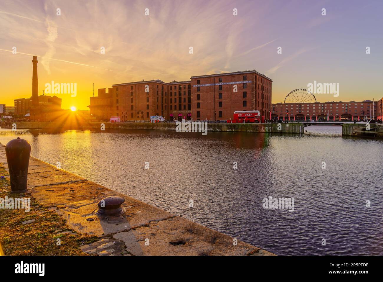 Liverpool, UK - October 09, 2022: Sunrise view of the Royal Albert Dock, with various buildings, in Liverpool, Merseyside, England, UK Stock Photo