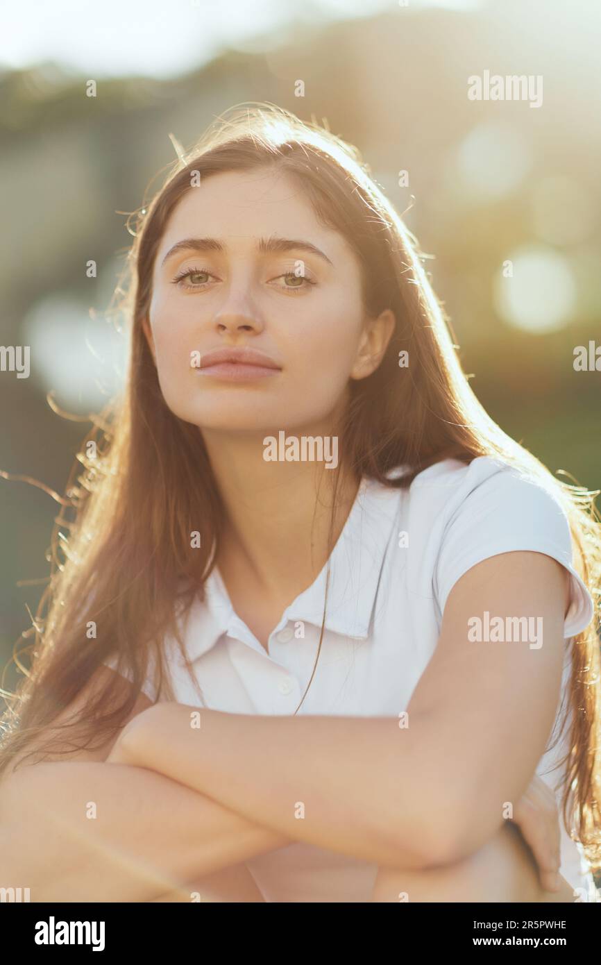 portrait of pretty young woman with long hair and natural
