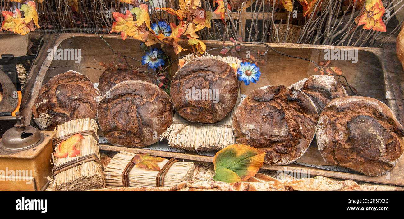 Freshly baked bread in bakery window. Stock Photo