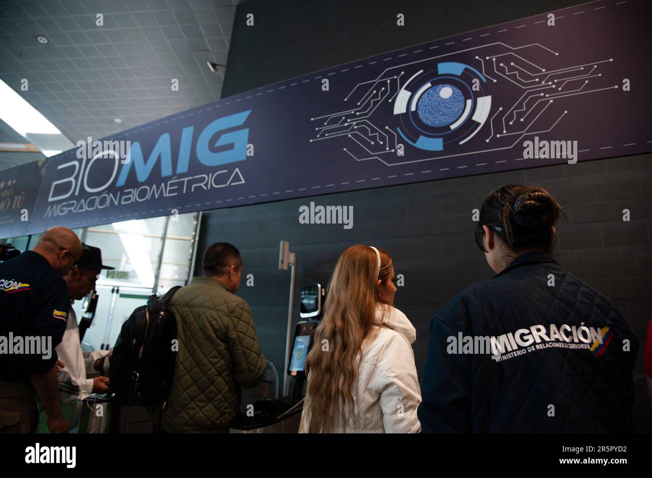 Passangers use the new biometric migration system during the launch of 'BIOMIG' a new biometric migration system aimed for foreigners in El Dorado Int Stock Photo