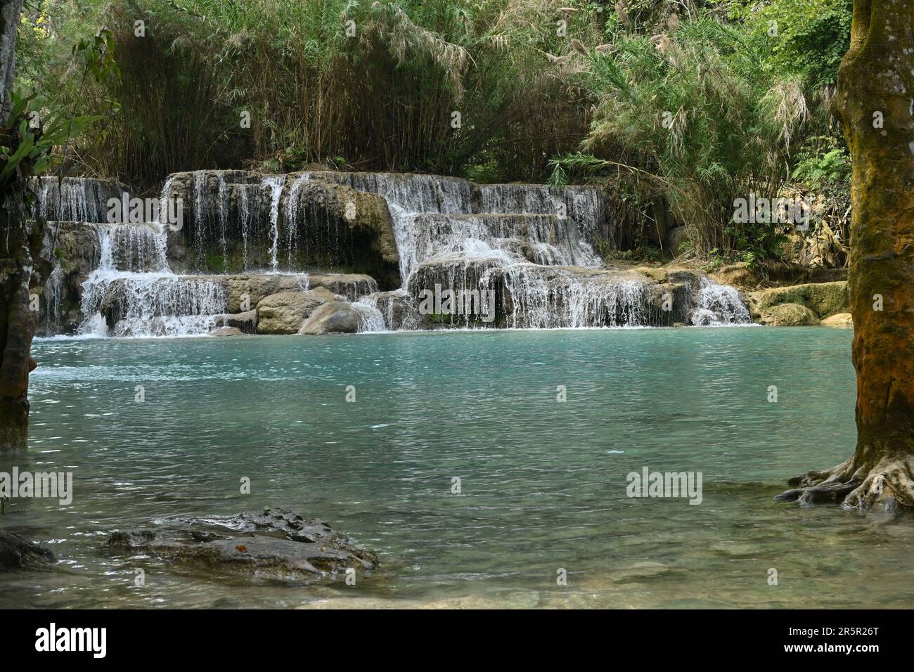 View of Kuang Si waterfalls, a three-tiered waterfall about 29km south of Luang Prabang, Laos Stock Photo