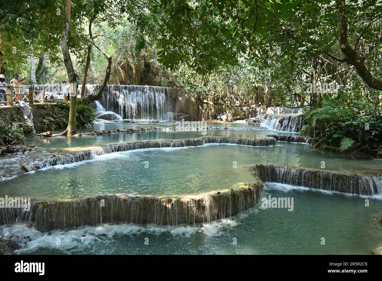 View of Kuang Si waterfalls, a three-tiered waterfall about 29km south of Luang Prabang, Laos Stock Photo