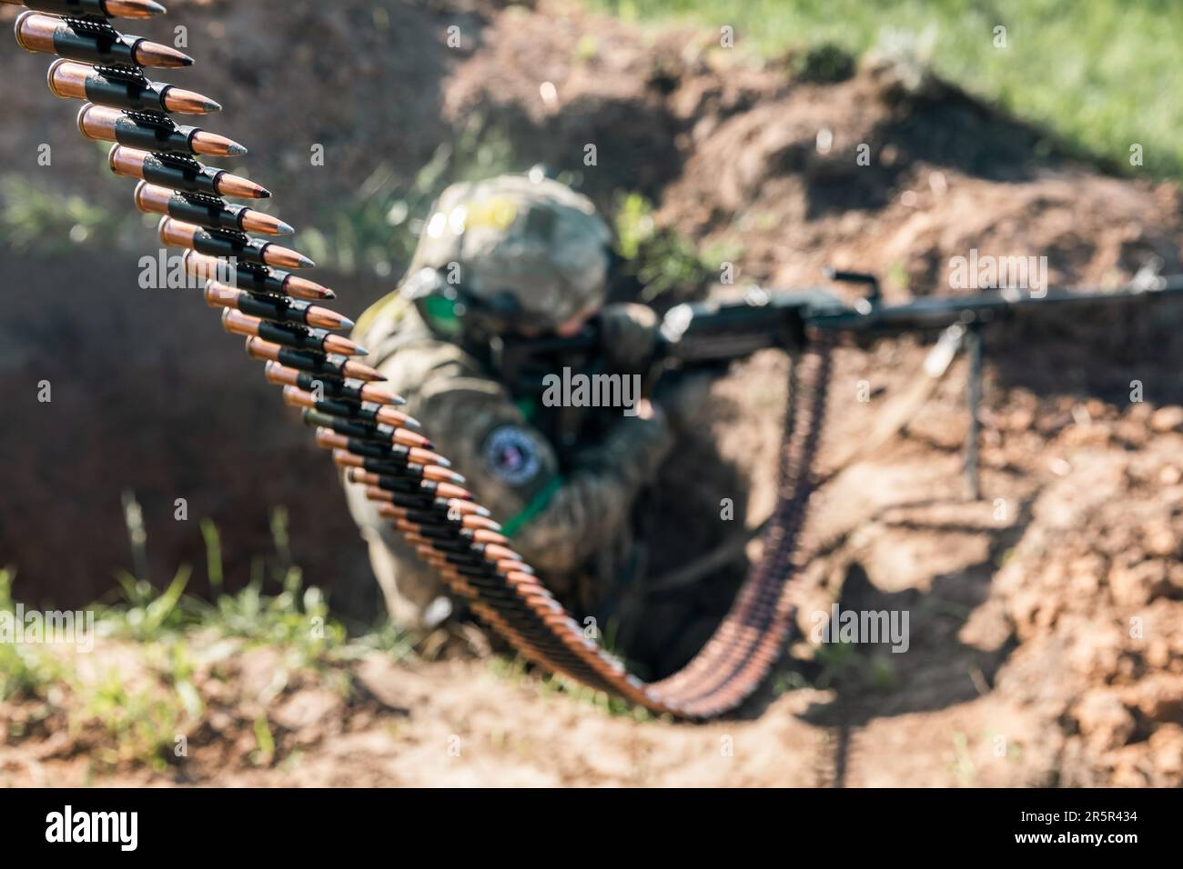 A Ukrainian Armed Forces soldier fires an automatic weapon during ...