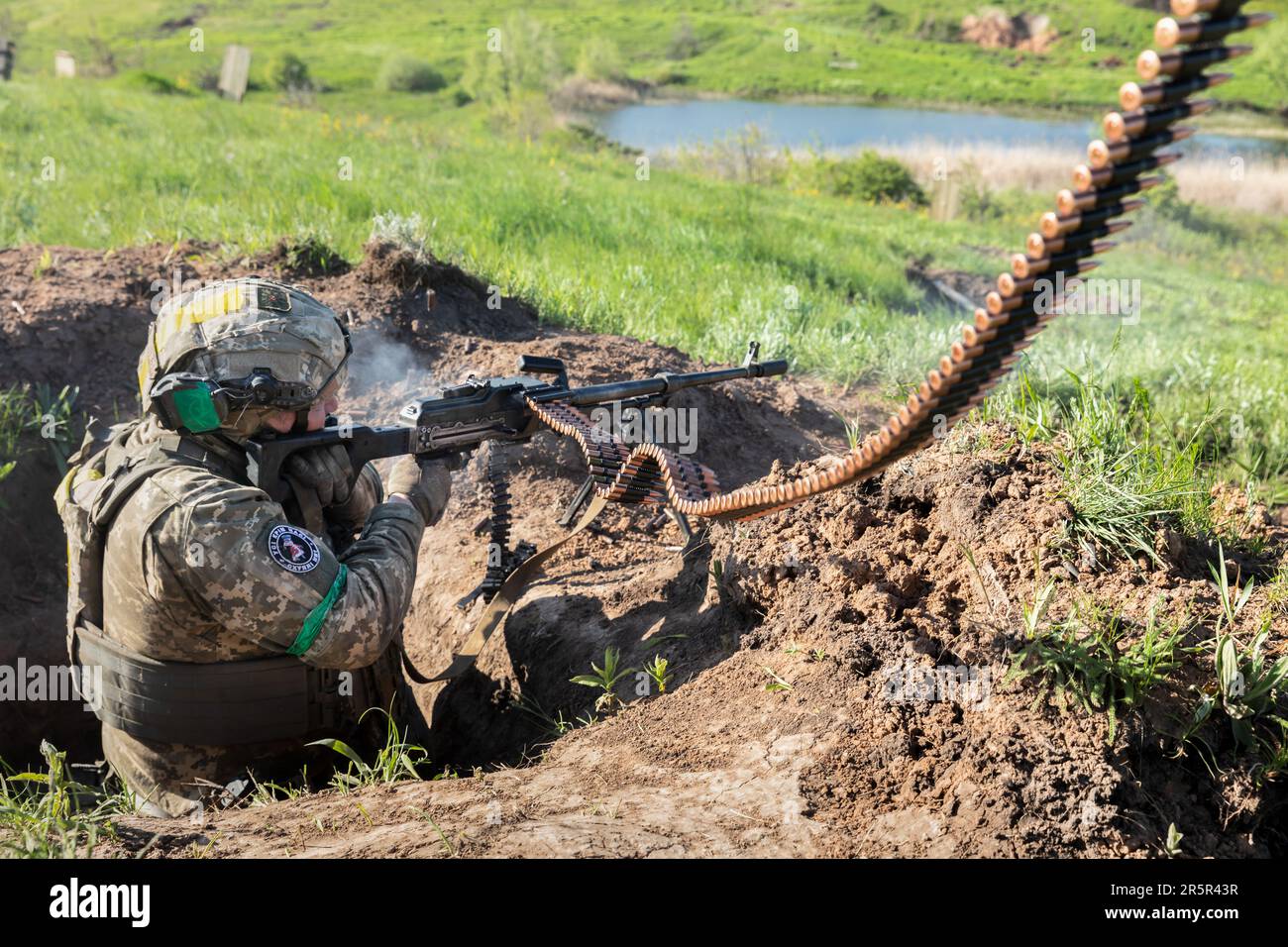 A Ukrainian Armed Forces soldier fires an automatic weapon during ...