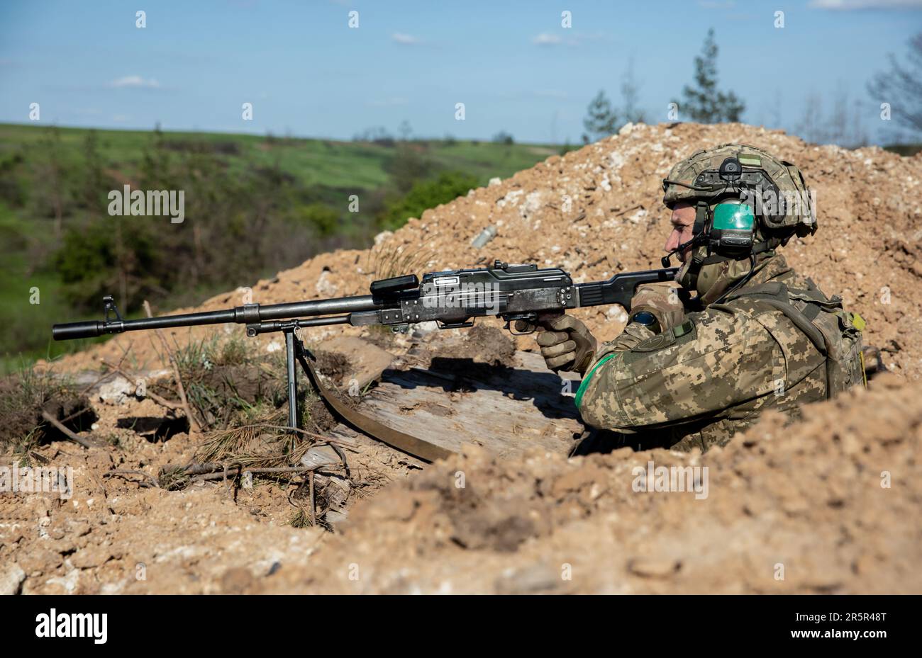 A Ukrainian Armed Forces soldier fires an automatic weapon during ...