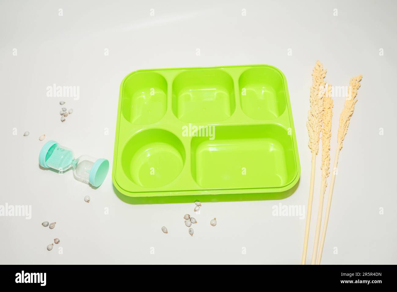 The Green Plastic Lunch Box is a convenient and practical meal storage solution. Stock Photo